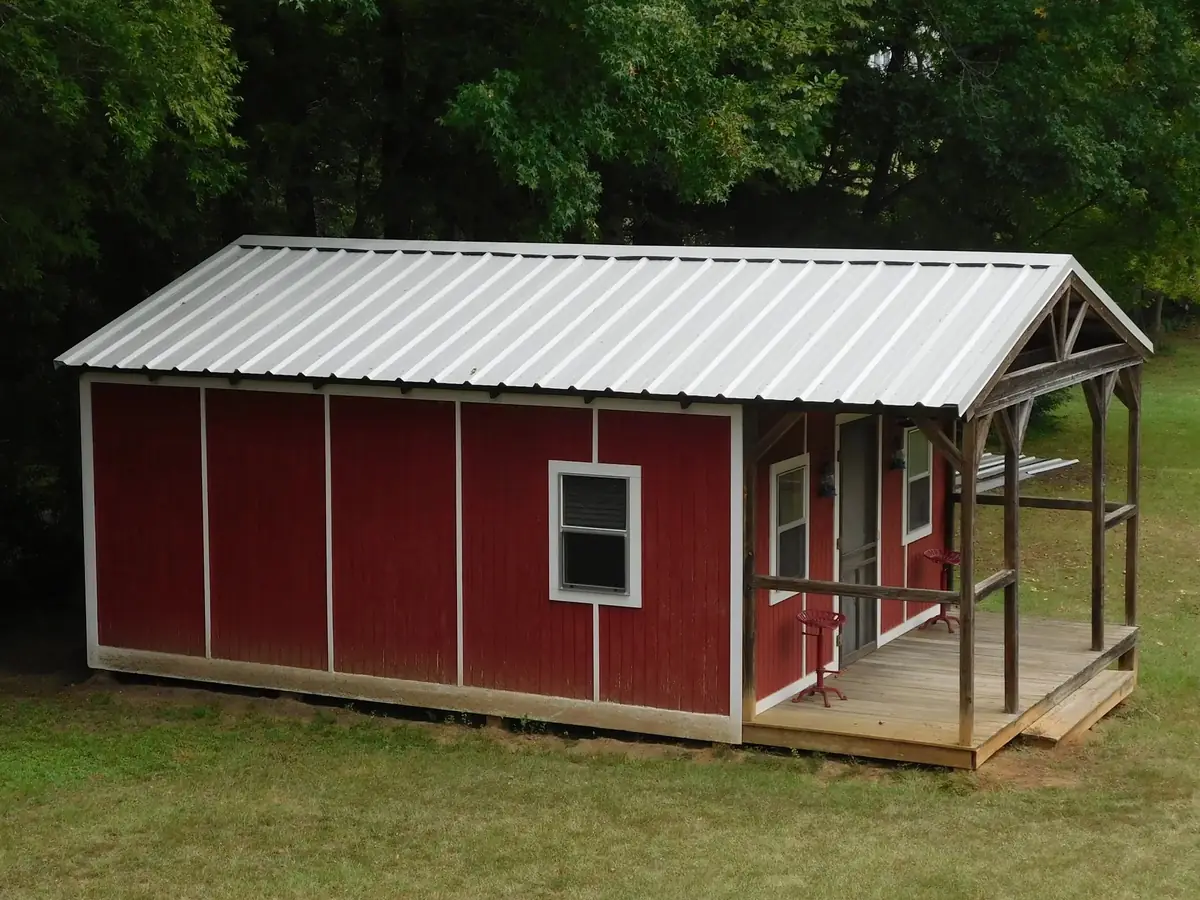 After: red barn with a new R-Panel metal roof, Tyler